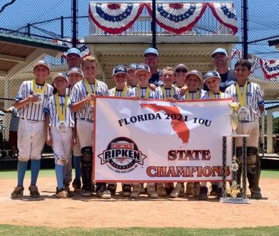 Eagle Lake Sport's Association 12u champions posing for a group photo, in front of their winning banner
